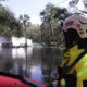 Rescuers warn of hazards walking through floodwater in Milton aftermath