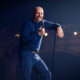 What sets Bill Burr apart from the comedic manosphere