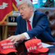 ‘Swag bag’: Trump reportedly won over GOP holdouts with signed merch
