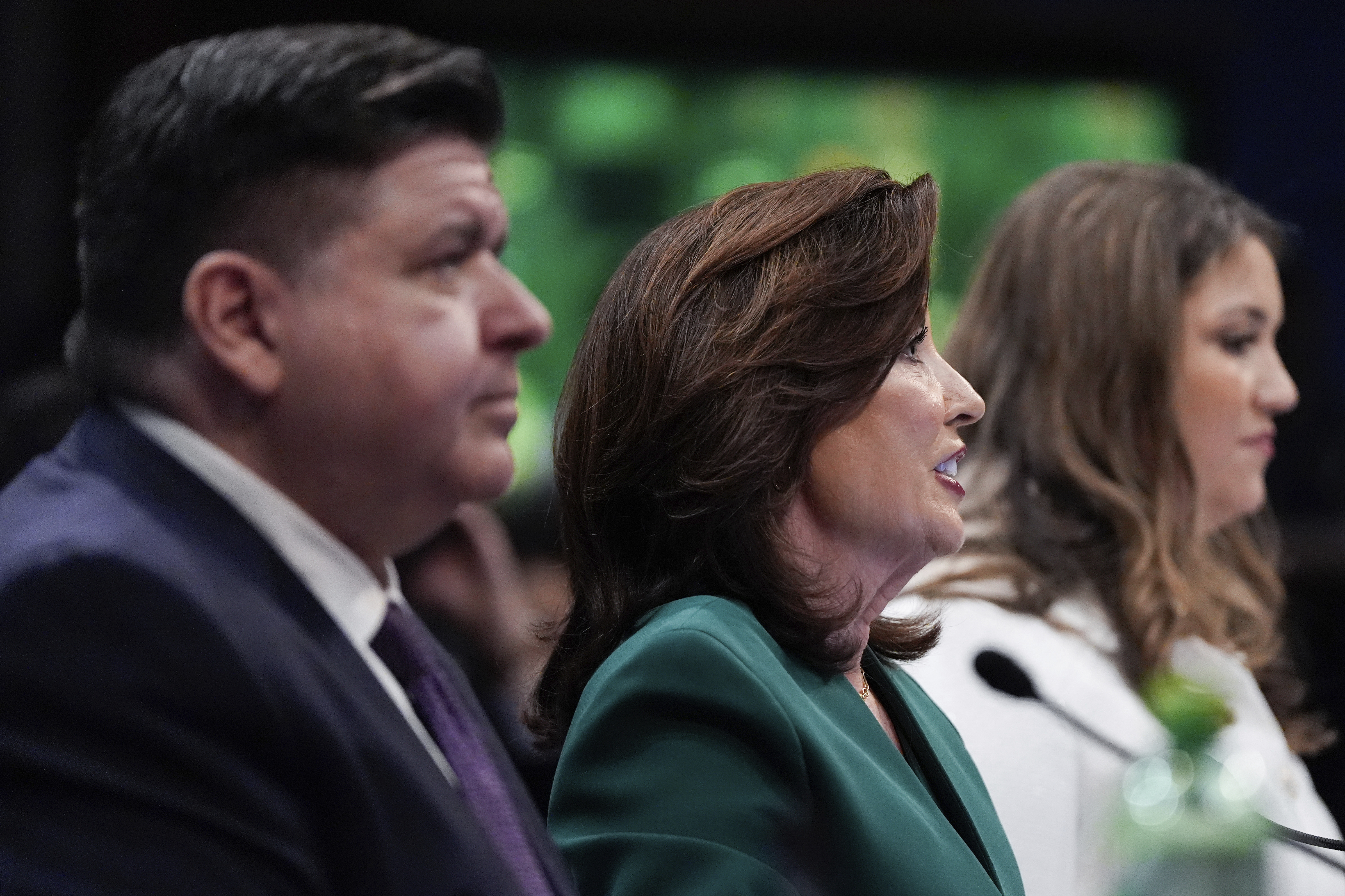 Hochul, center, is one of the governors mulling a redistricting bid. 