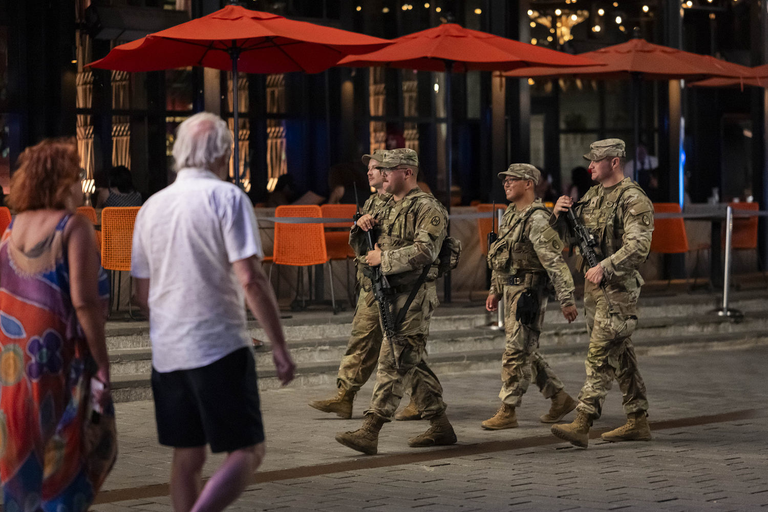 National Guard troops begin carrying firearms in Washington