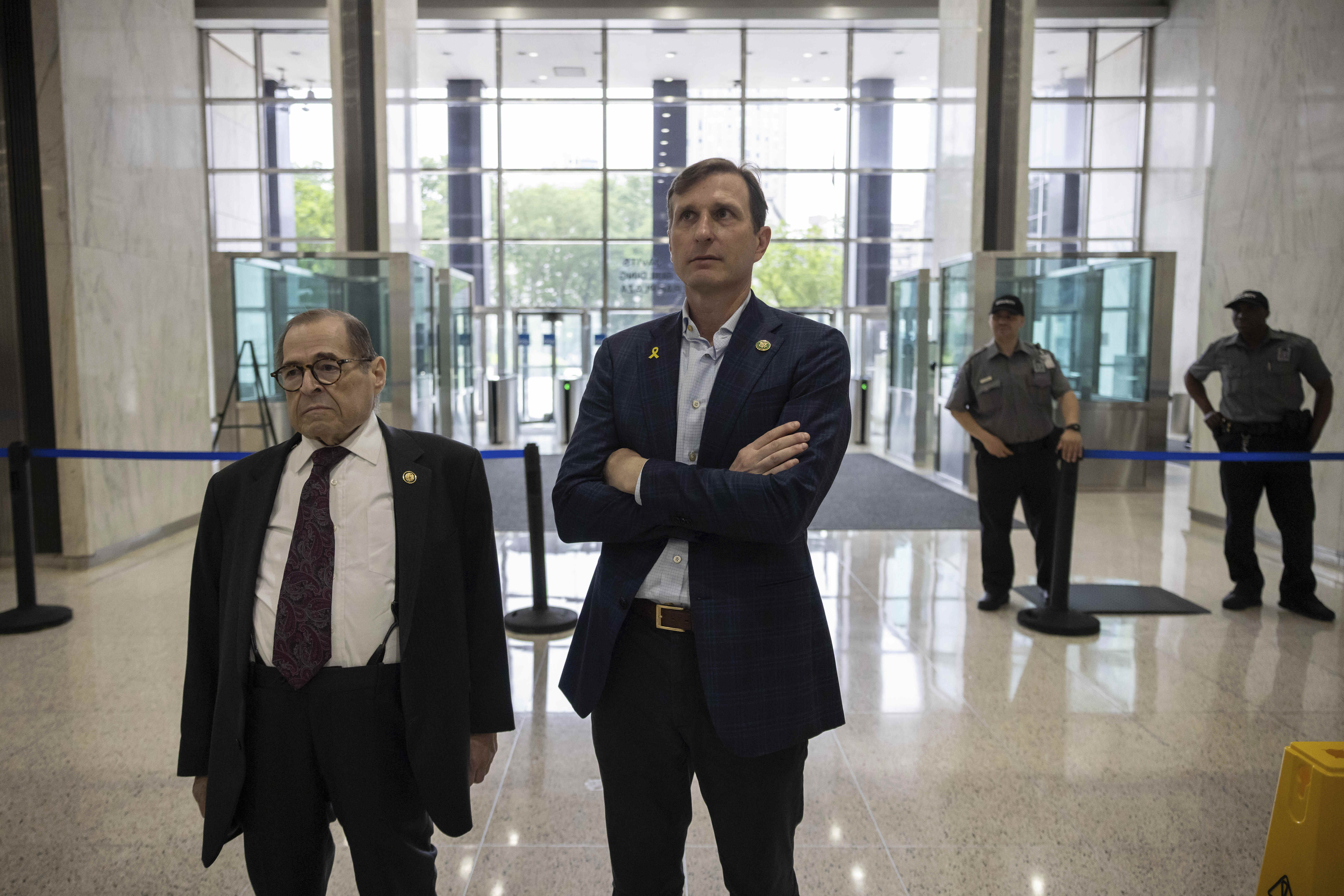 Reps. Dan Goldman and Jerry Nadler visit a federal building in June. He and 11 other House Democrats are suing the Trump administration to access federal immigrant detainment facilities. 