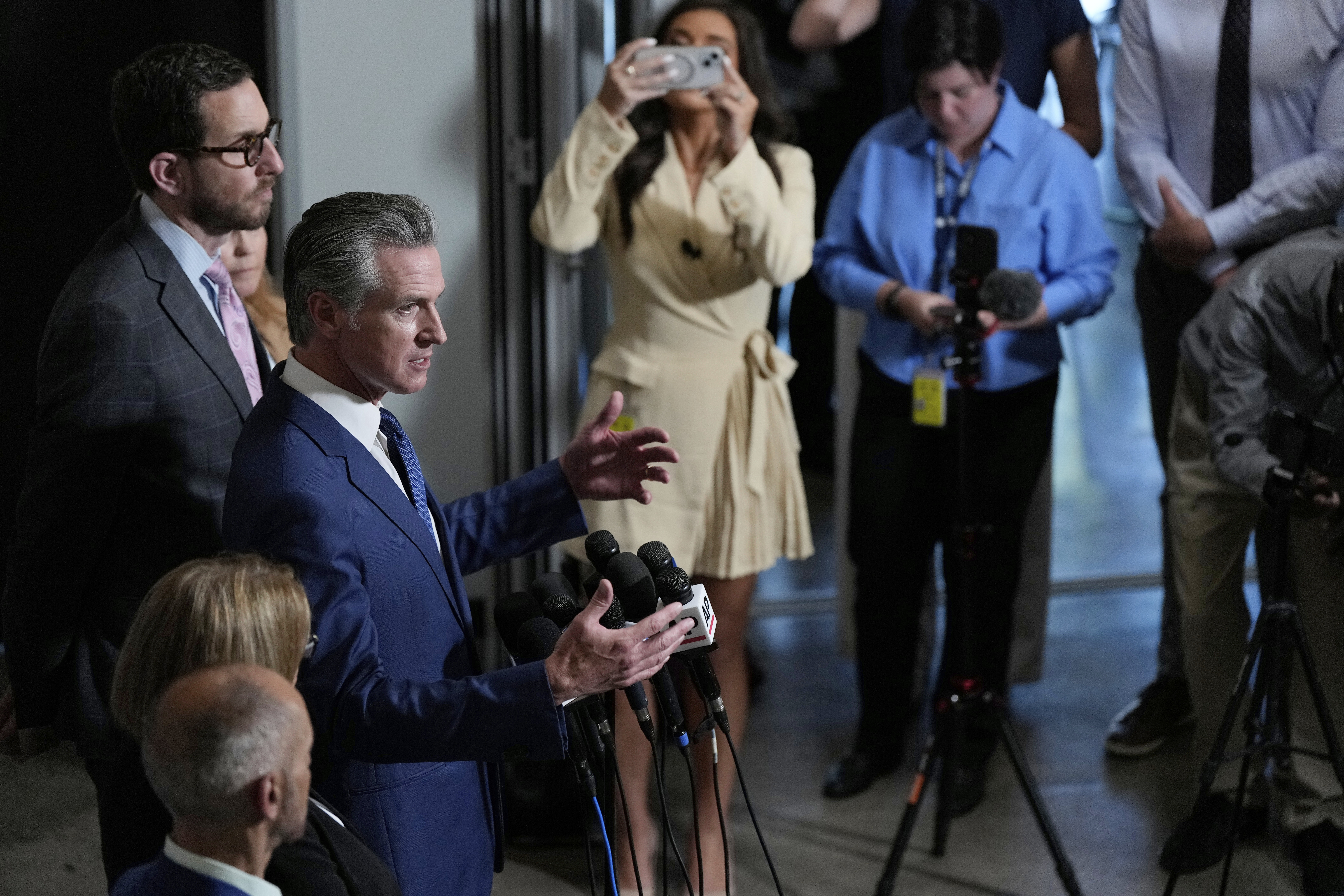 California Gov. Gavin Newsom answers questions after signing legislation calling for a special election on a redrawn congressional map on Thursday, Aug. 21, 2025, in Sacramento, Calif. (AP Photo/Godofredo A. Vásquez)