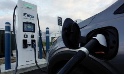Companies hit the brakes on EVs, lay off thousands