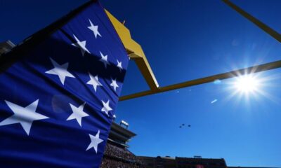 Parachutist crash lands near stands at Armed Forces Bowl