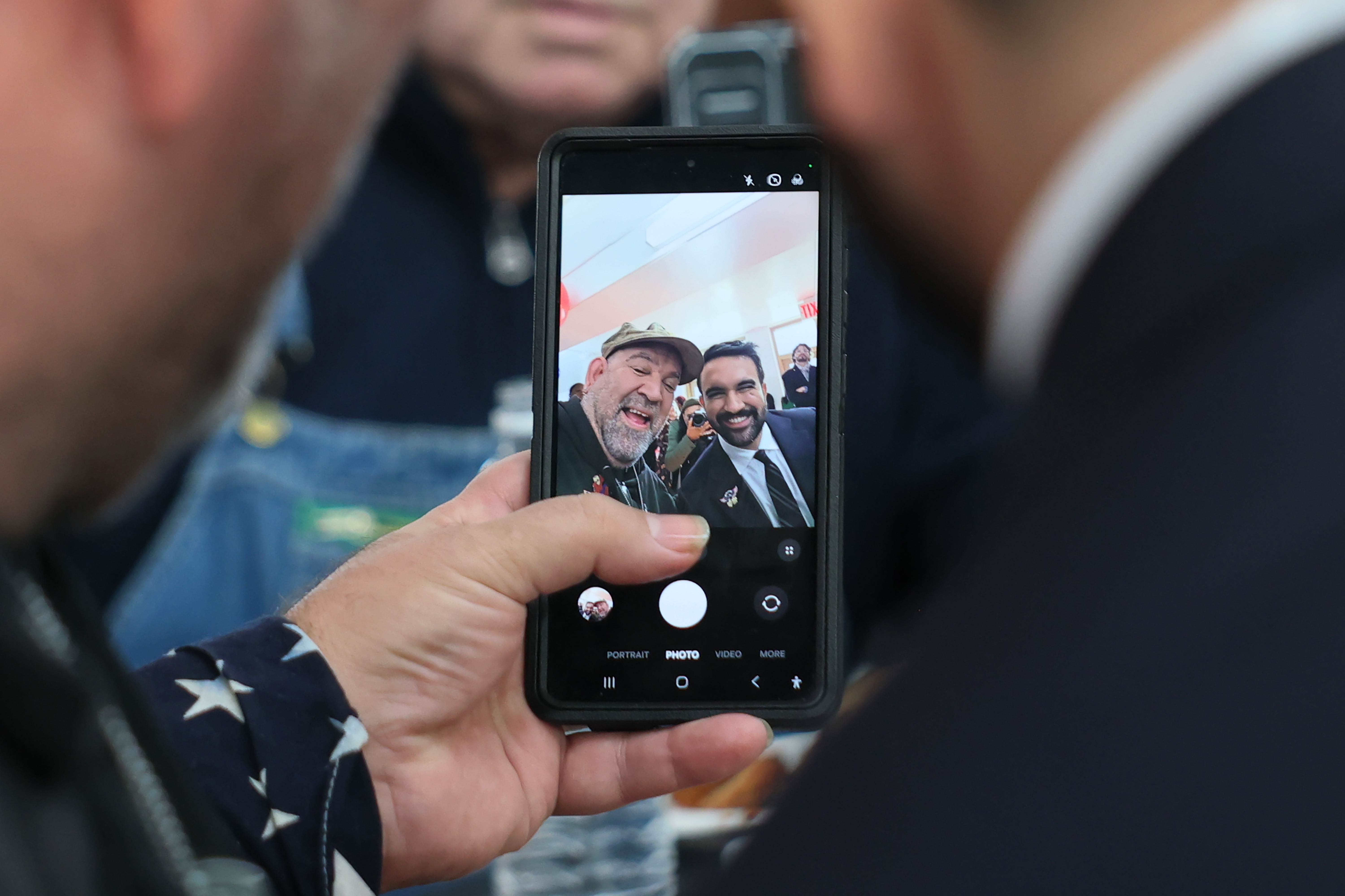 Mayor-Elect Zohran Mamdani takes a selfie with a former Marine on Veterans Day. 