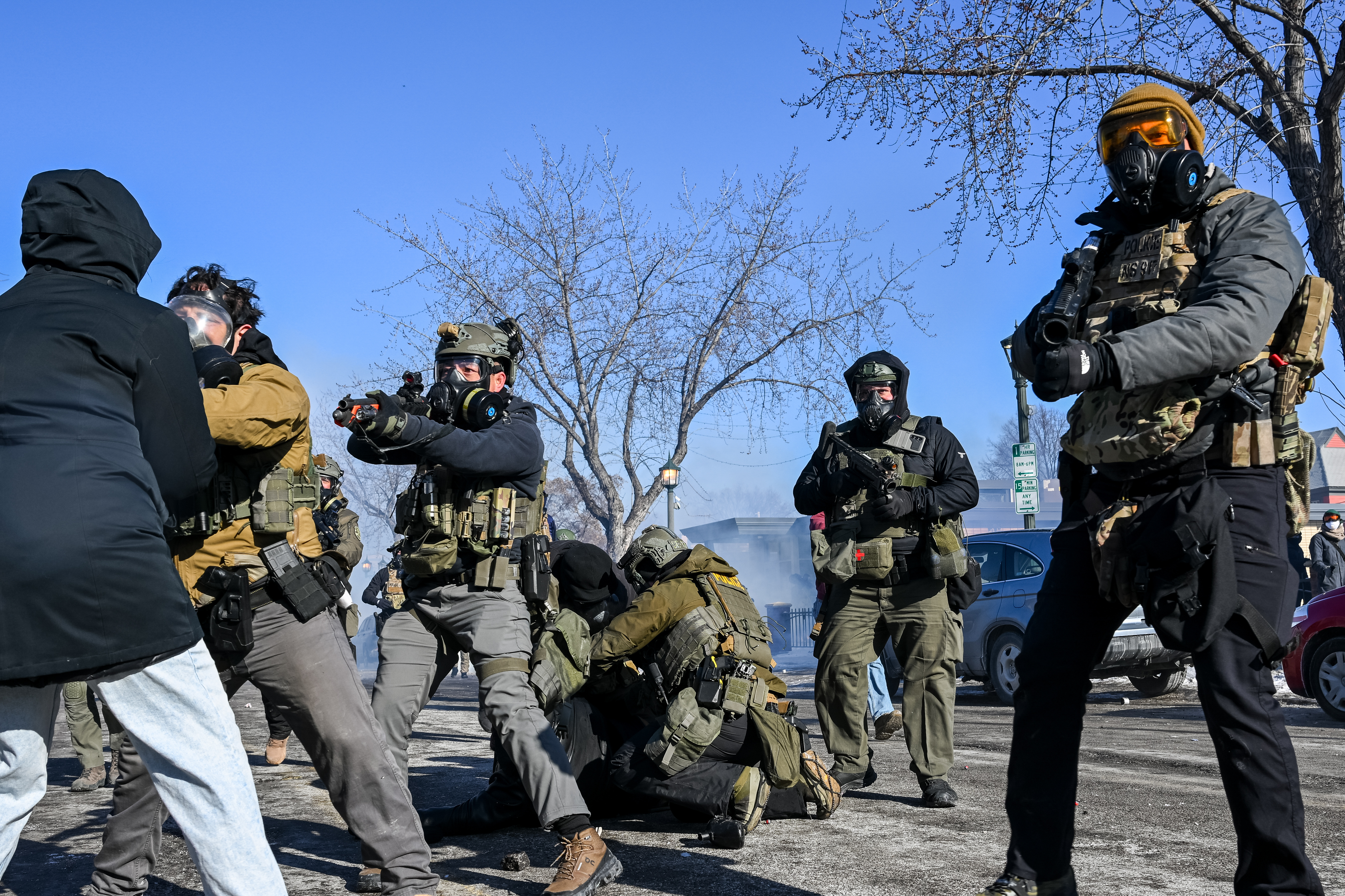 A person is tackled by a federal agent amid protests following a shooting in Minneapolis, Minnesota, on Jan 24, 2026.