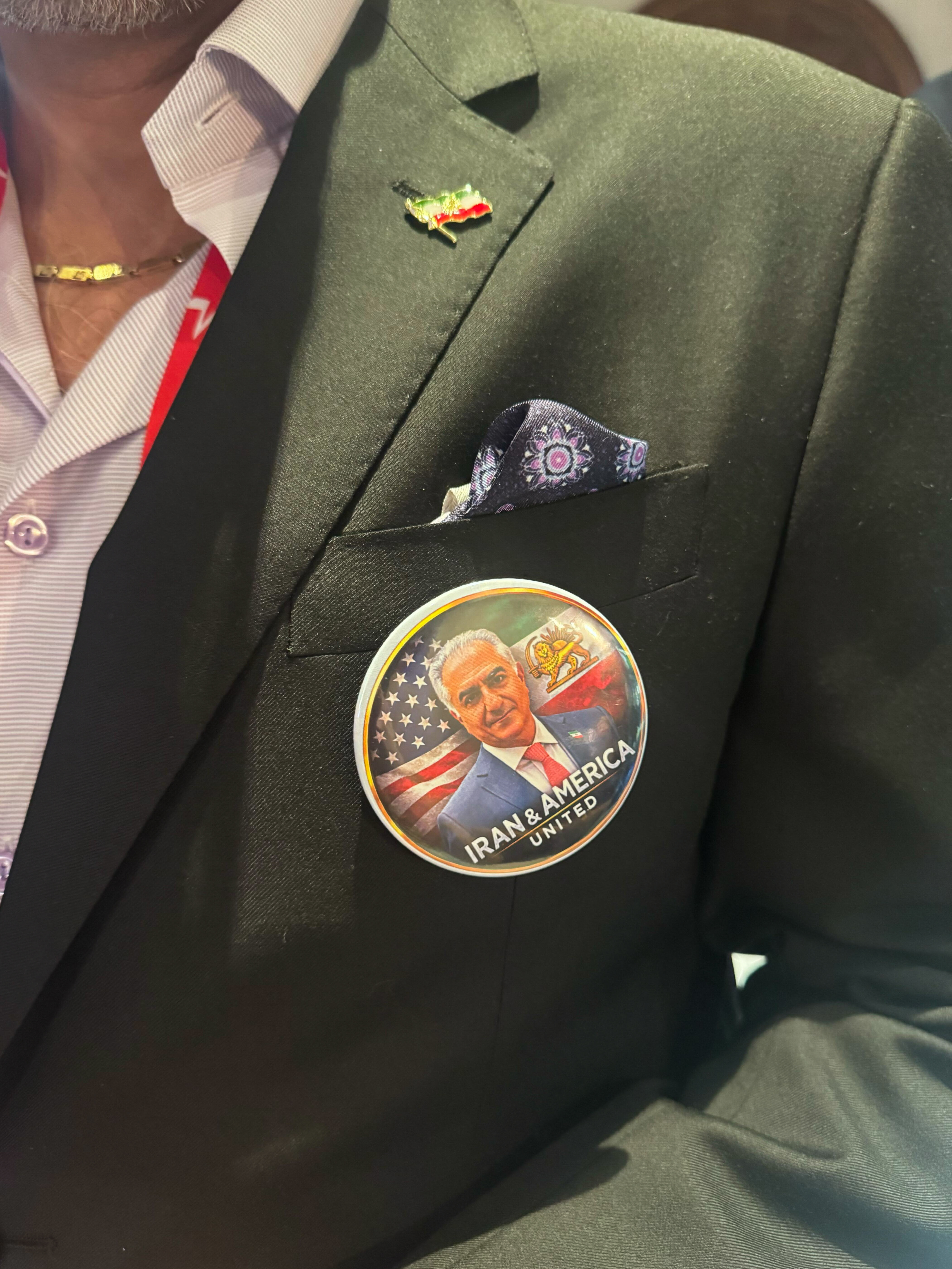 Scores of mostly older conservatives milled about wearing shirts, pins, and other items with the image of exiled Iran Crown Prince Reza Pahlavi, who is set to speak at the conference on Saturday.