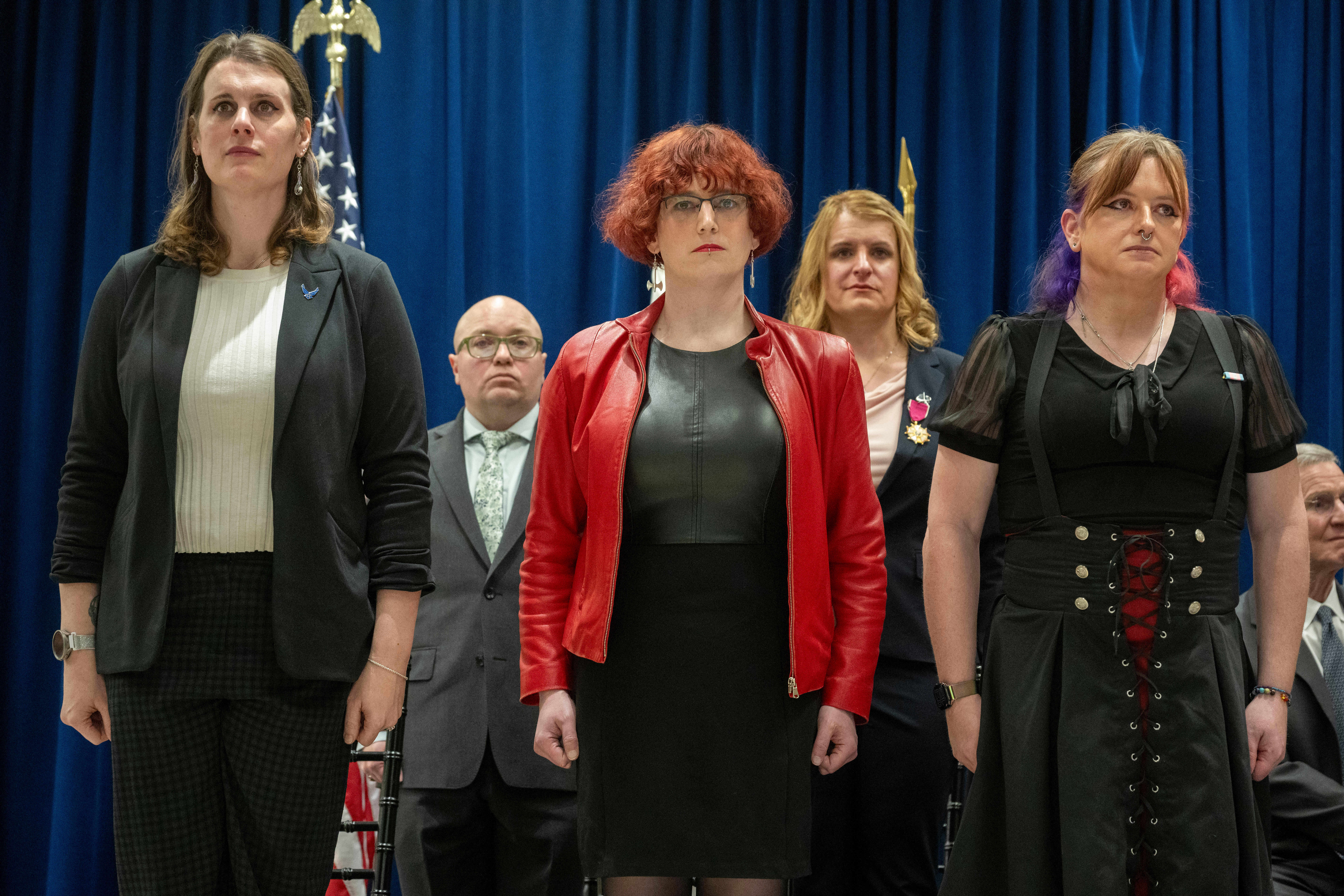 Fram, second from right, stands with other transgender members of the military during their retirement ceremony at the Human Rights Campaign Headquarters in Washington, on Jan. 8, 2026. 