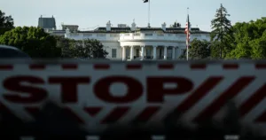 A bulletproof vest, ballistic glass and a president who carries on