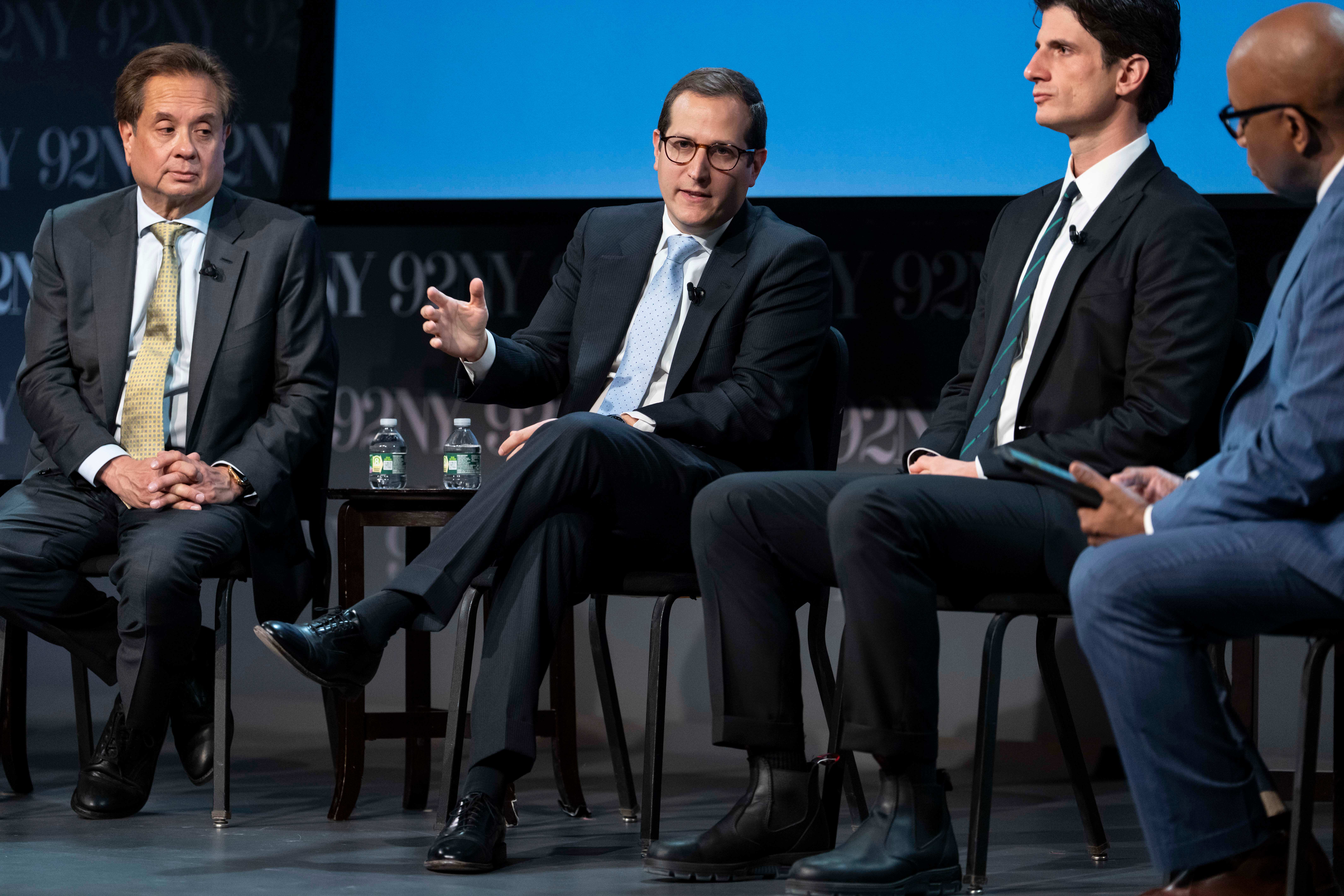 Assemblymember Micah Lasher, second from left, voted on budget items in Albany before returning to New York City hours later for a candidate forum.