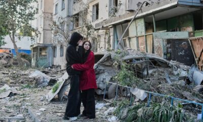 Russian attack on Ukraine capital kills at least 3 and traps others in damaged buildings