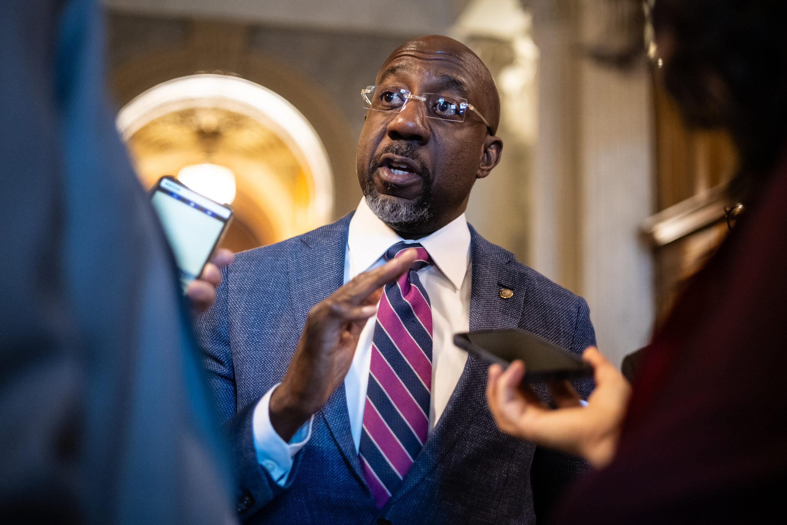 Raphael Warnock meets with Mike Johnson after questioning speaker’s Christian faith