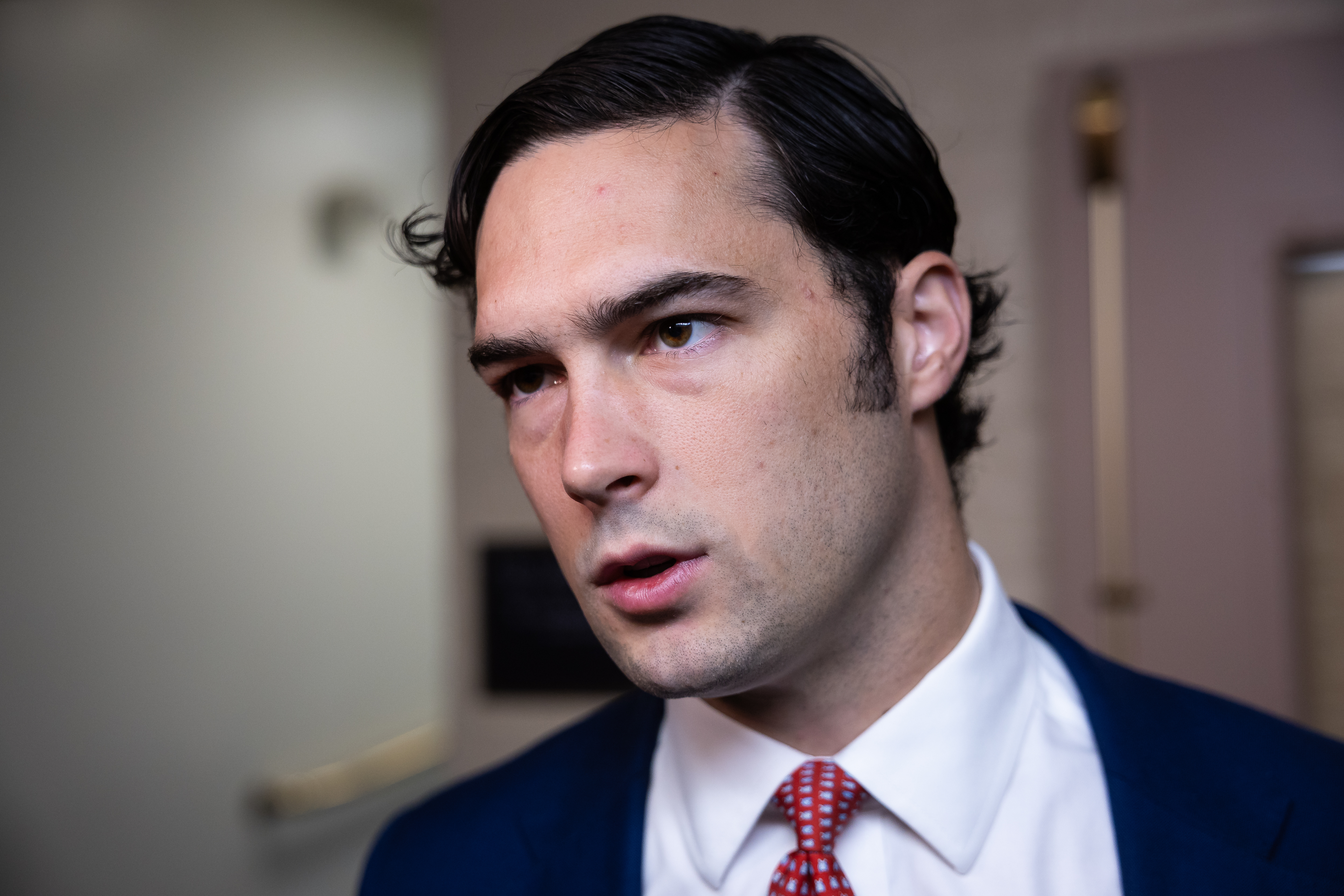 Rep. Brandon Gill (R-Texas) speaks with reporters as he departs a House Republican Conference meeting at the U.S. Capitol on March 25, 2026.