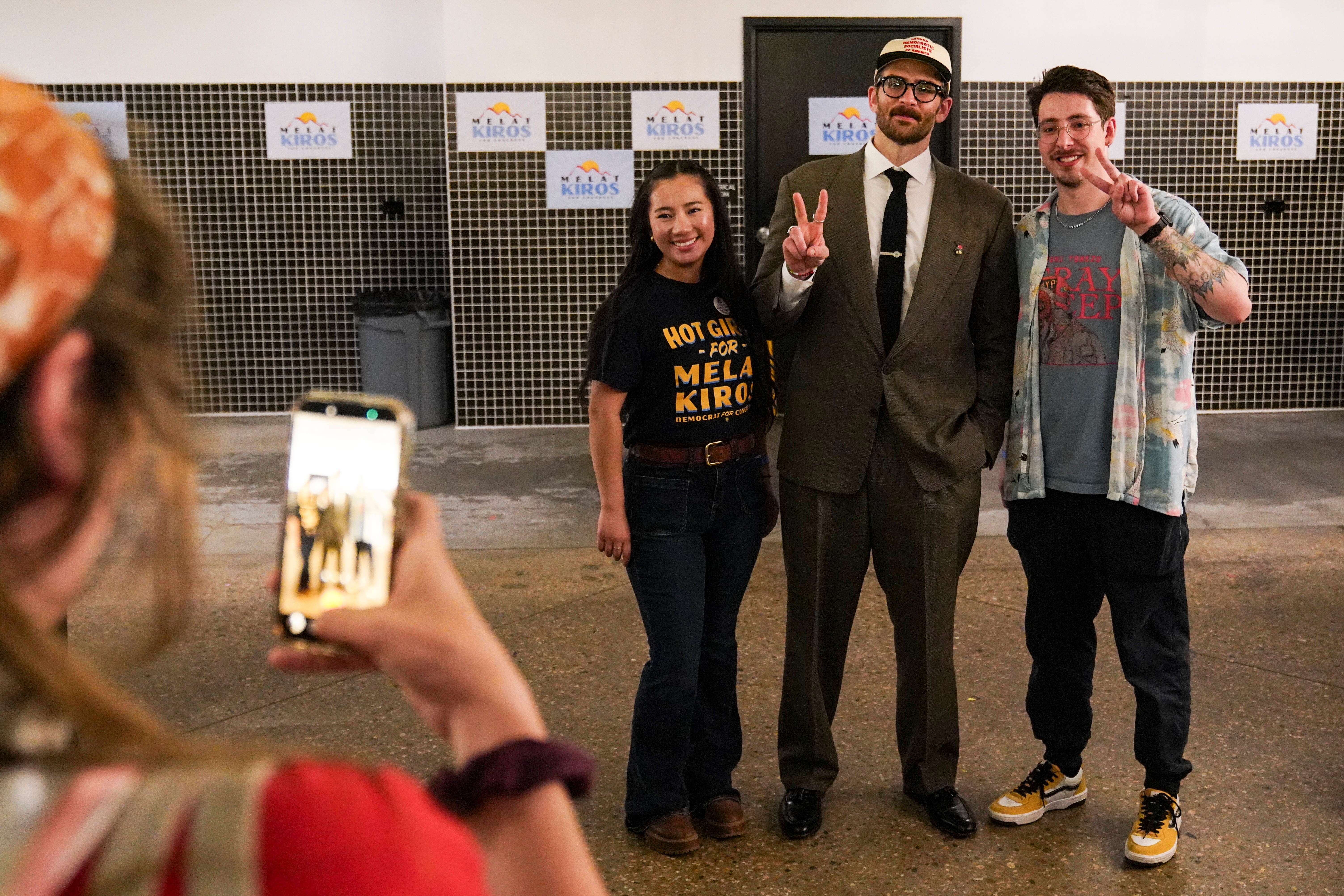 Hasan Piker, center, takes a photo with attendees of Colorado democratic socialist Melat Kiros' primary election night watch party Tuesday, June 30, in Denver. 