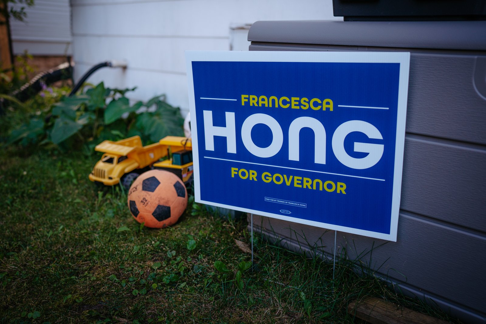 A sign supporting Hong is seen in a yard in Oshkosh.