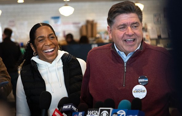 Then-Illinois Democratic Senate candidate  Juliana Stratton and Gov. JB Pritzker speak to reporters at Manny's Cafeteria and Delicatessen on March 17, 2026, before the polls closed.