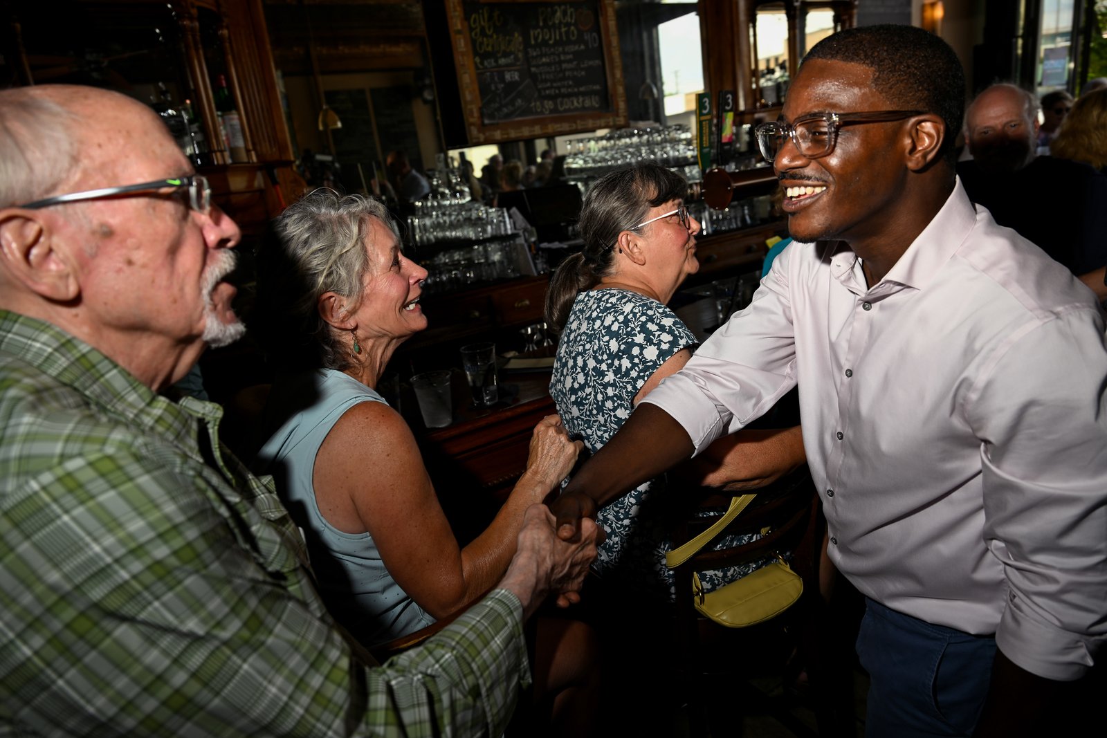 Wisconsin gubernatorial candidate David Crowley greets people during a campaign stop at Urbane restaurant in Sheboygan, Wisconsin, on Aug. 7.