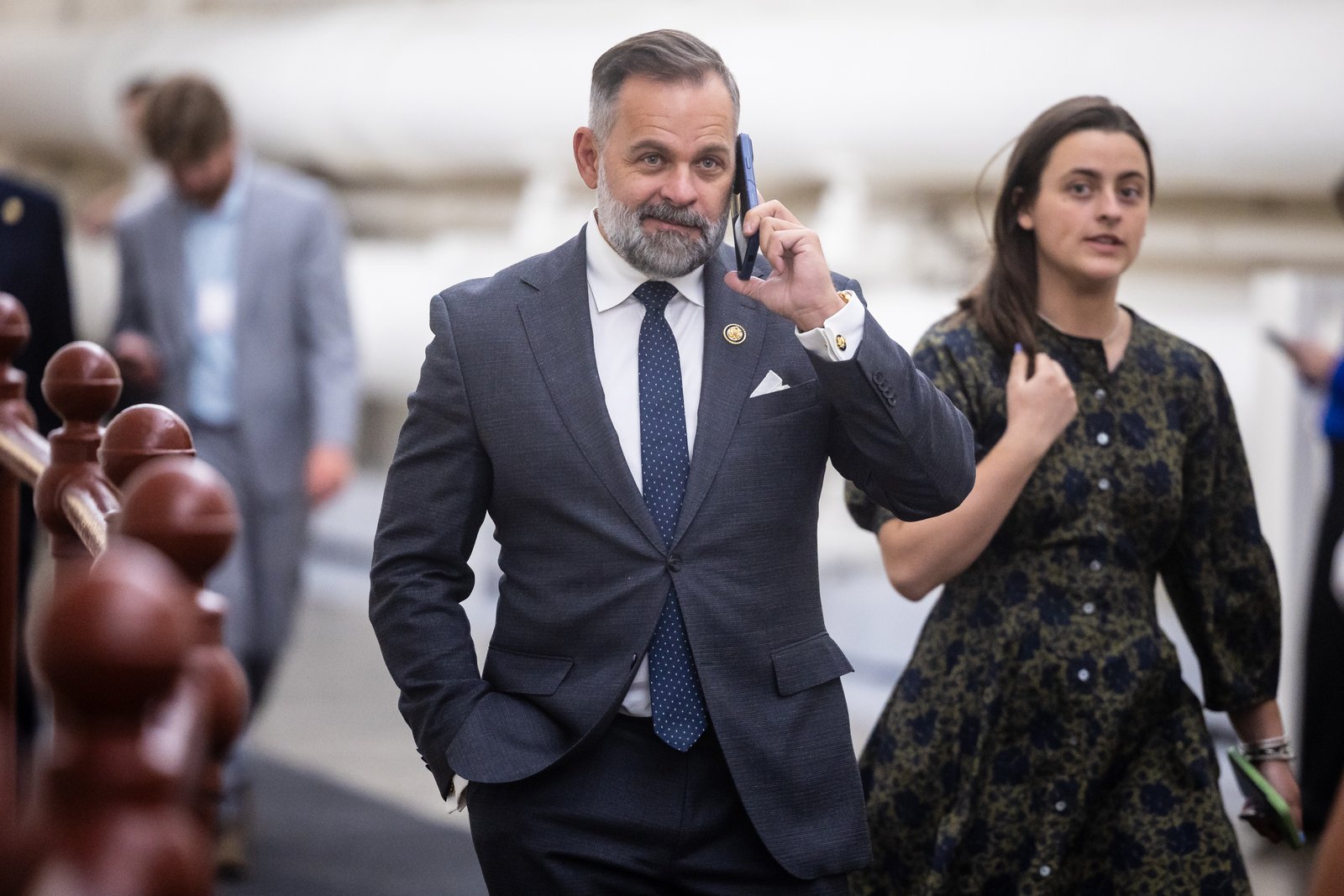 Rep. Cory Mills (R-Fla.) holds a phone to his ear as he walks to a vote at the U.S. Capitol on April 15, 2026. (Francis Chung/POLITICO via AP Images)