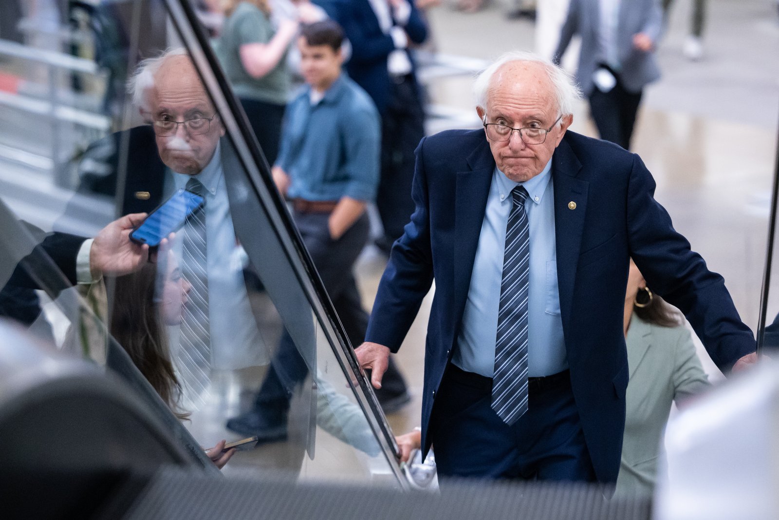 Sen. Bernie Sanders (I-Vt.) ascends on an escalator on his way to a vote at the U.S. Capitol in Washington, on July 30.