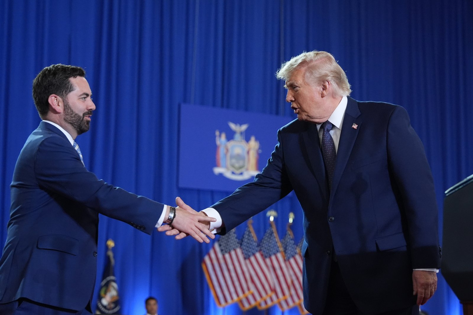 Rep. Mike Lawler and President Donald Trump shake hands at Rockland Community College in Suffern, New York, on May 22.