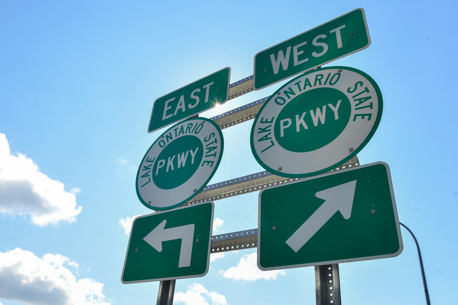 Signs mark the entrance to the Lake Ontario State Parkway on Aug. 25, 2026, in Rochester, N.Y.